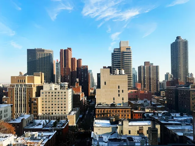 a view of a city with tall buildings