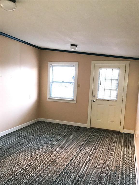 429 Hege Road Lexington, NC 27295 - Photo 19 of 29 Concrete block bonus room with access through back entrance to house as well as separate entry door from front drive could be a great office space.
