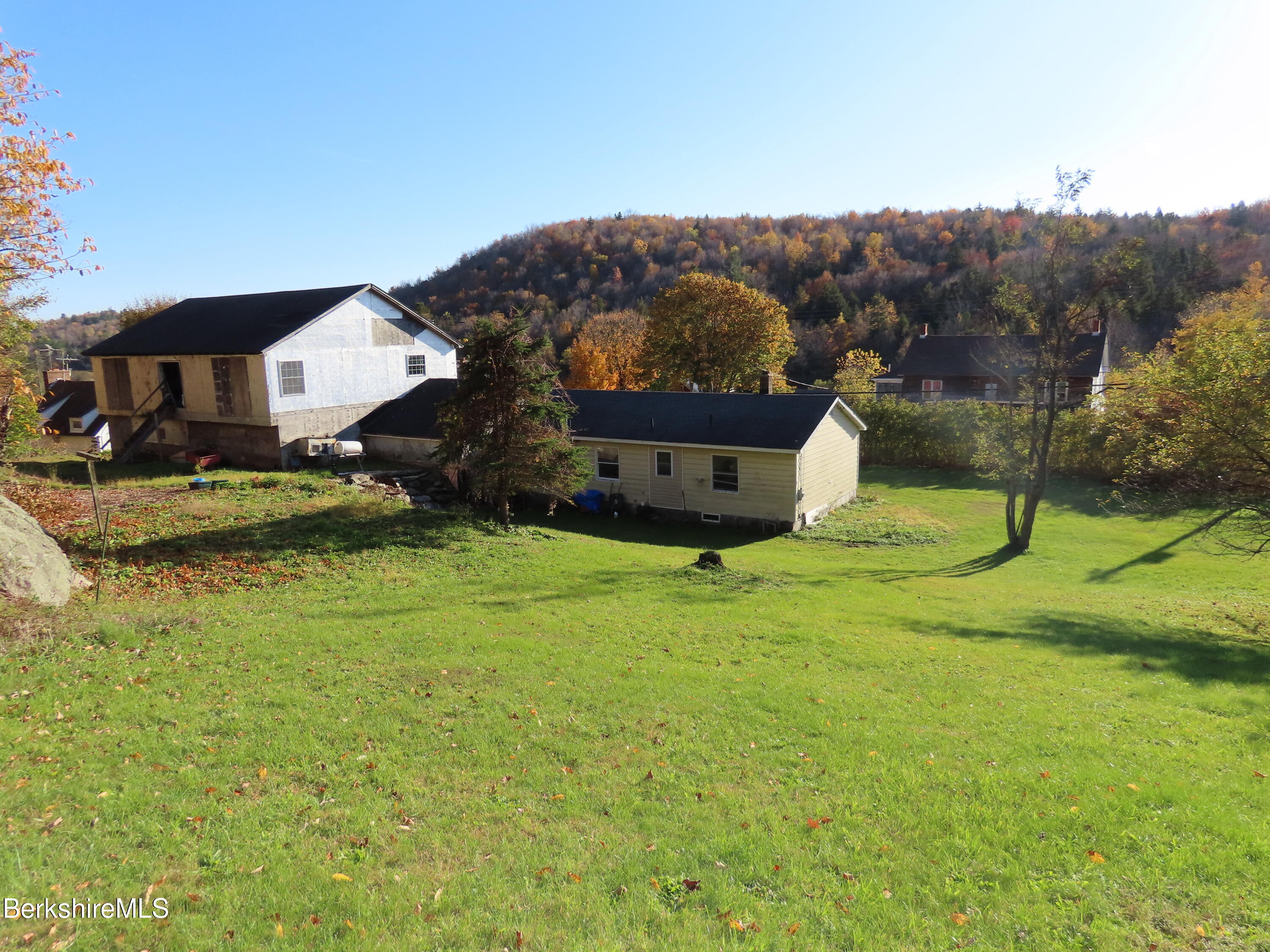 669 Main Road Savoy, MA 01256 - Photo 3 of 36 a view of a house with a yard