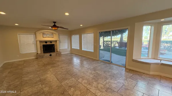 a kitchen with stainless steel appliances granite countertop a stove a sink and a wooden cabinets