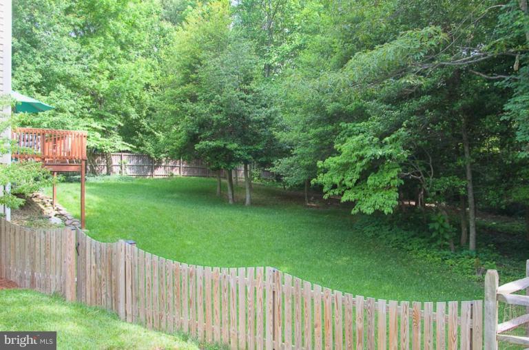 383 Yorkshire Lane Riva, MD 21140 - Photo 2 of 21 a view of a backyard with a garden