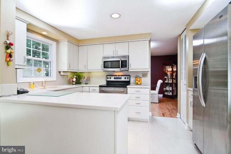 383 Yorkshire Lane Riva, MD 21140 - Photo 11 of 21 a kitchen with stainless steel appliances a refrigerator sink and a stove