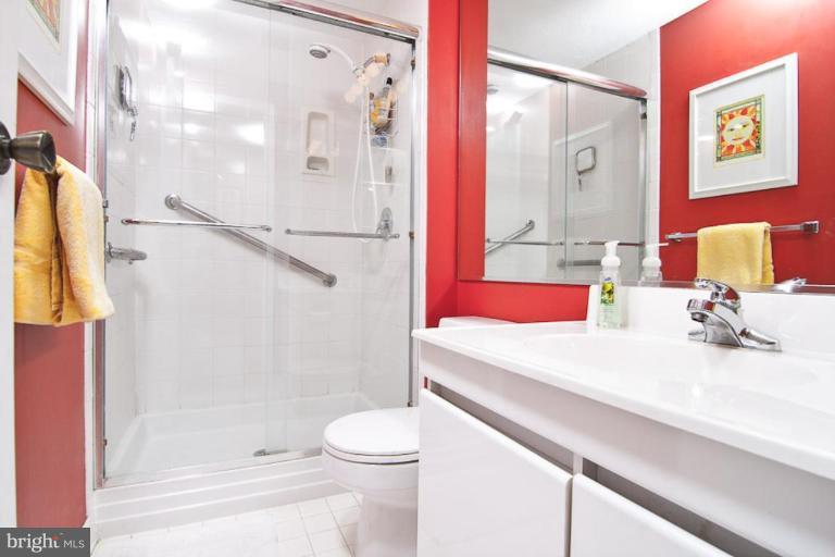 383 Yorkshire Lane Riva, MD 21140 - Photo 20 of 21 a bathroom with a sink vanity mirror and shower