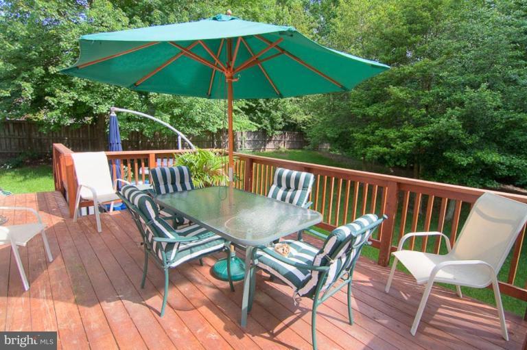 383 Yorkshire Lane Riva, MD 21140 - Photo 3 of 21 a view of balcony with furniture and umbrella