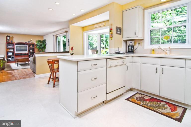 383 Yorkshire Lane Riva, MD 21140 - Photo 4 of 21 a open kitchen with stainless steel appliances granite countertop a stove and a sink