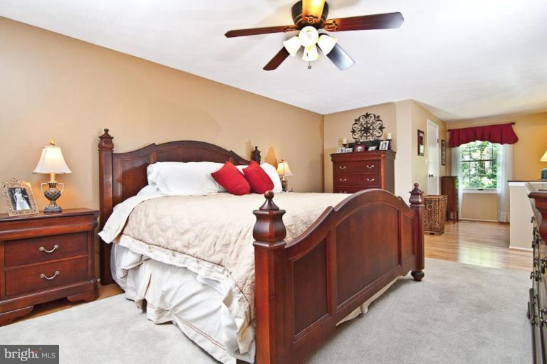 383 Yorkshire Lane Riva, MD 21140 - Photo 8 of 21 a bedroom with a bed and a chandelier