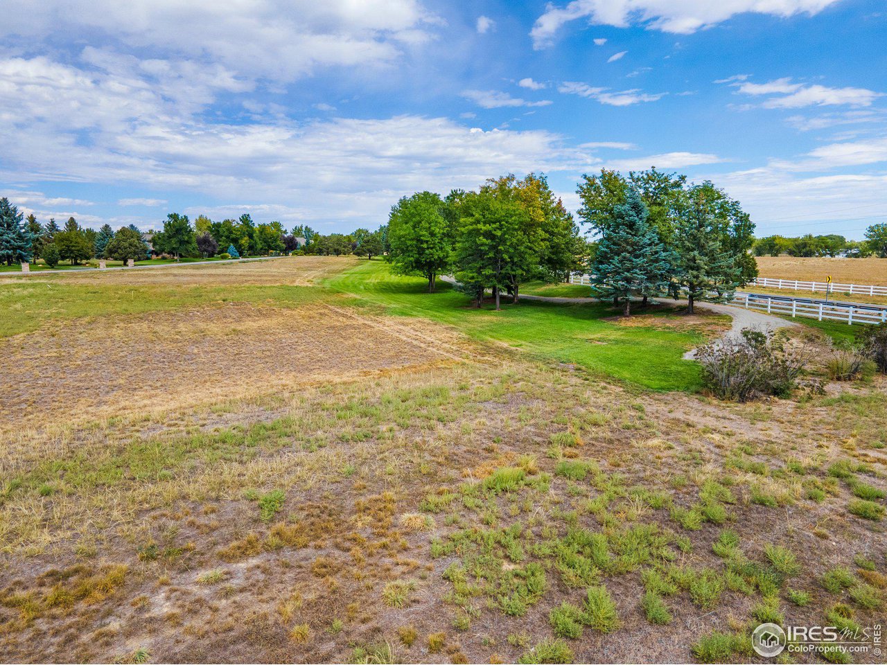 9432 Memory Lane Longmont, CO 80504 - Photo 14 of 22 a view of a lake with a big yard