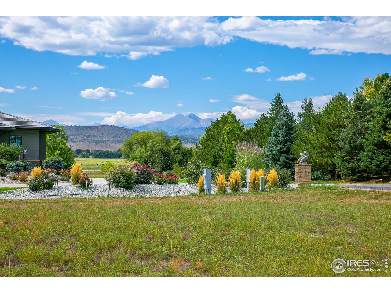 9432 Memory Lane Longmont, CO 80504 - Photo 22 of 22 a view of an house with backyard space and garden