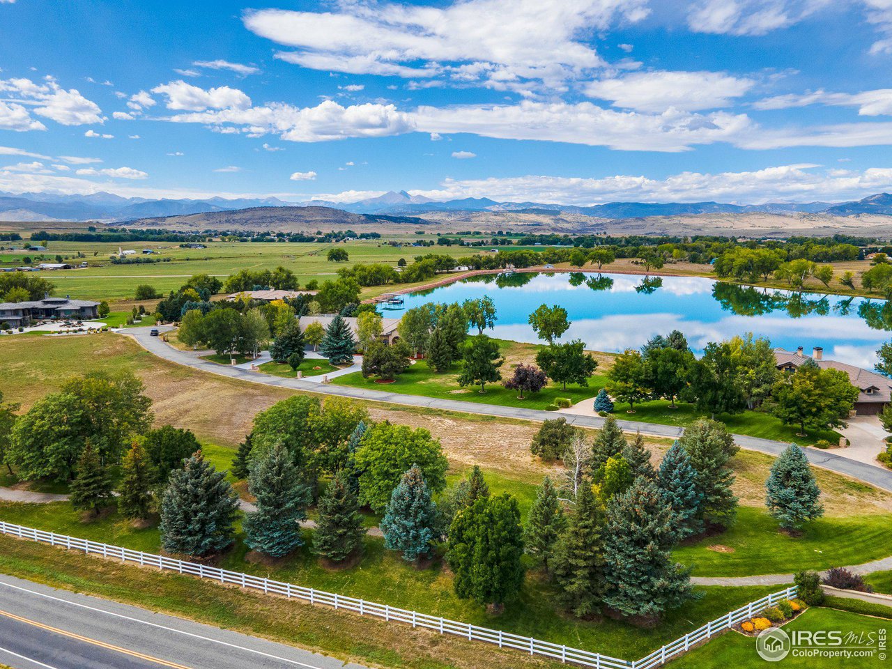 9432 Memory Lane Longmont, CO 80504 - Photo 9 of 22 a view of a lake with houses in the back