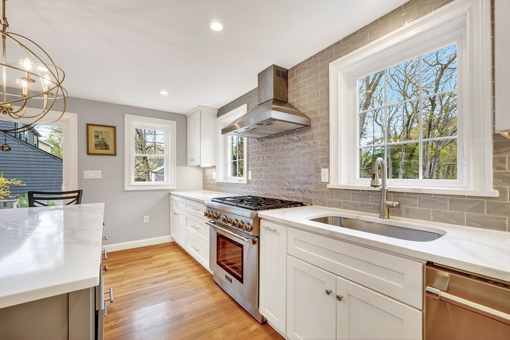 87 Payson Road Brookline, MA 02467 - Photo 13 of 41 a kitchen with a stove a sink and a window
