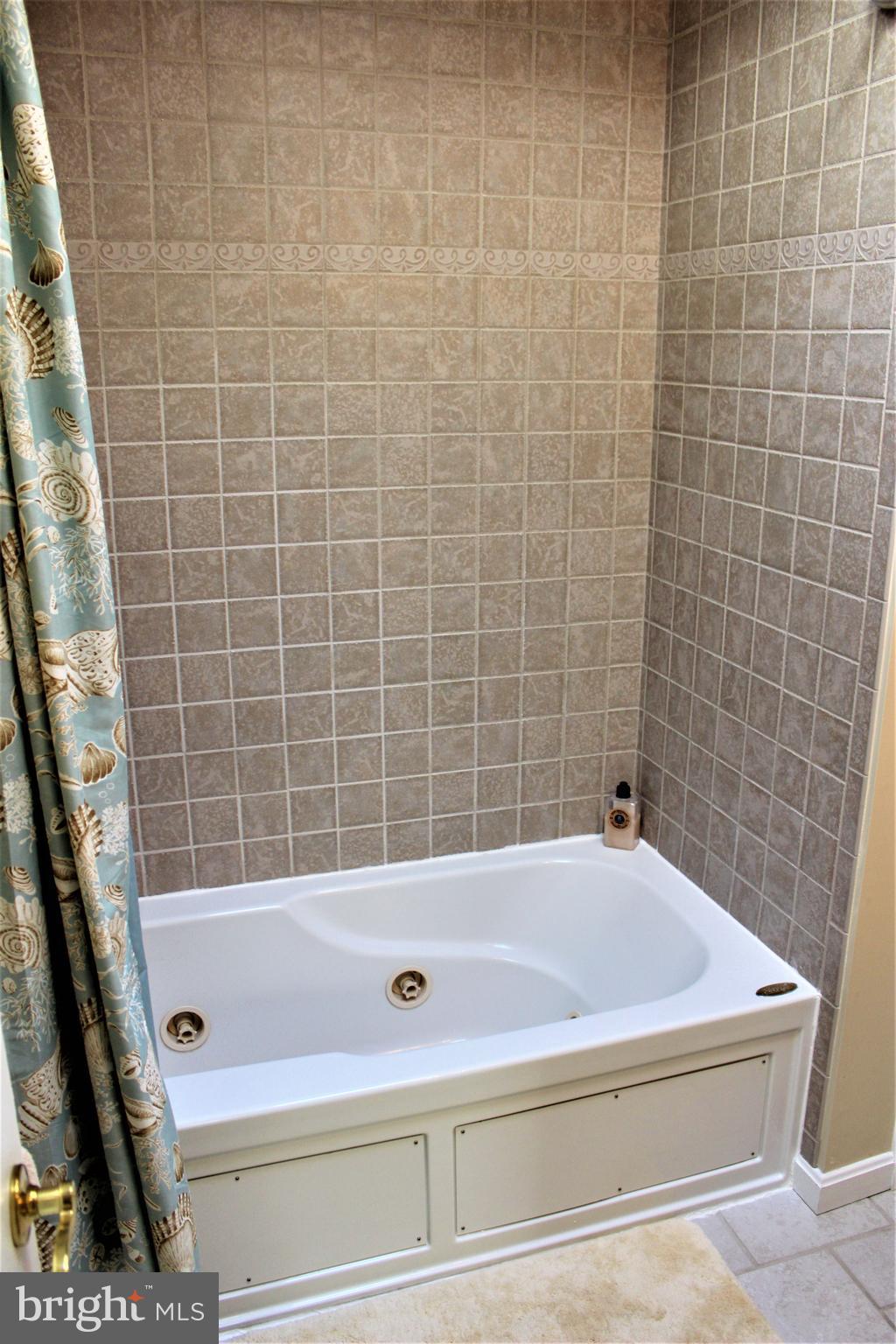14 Gloucester Road Ocean Pines, MD 21811 - Photo 22 of 35 Hall bath with tiled Jacuzzi tub shower