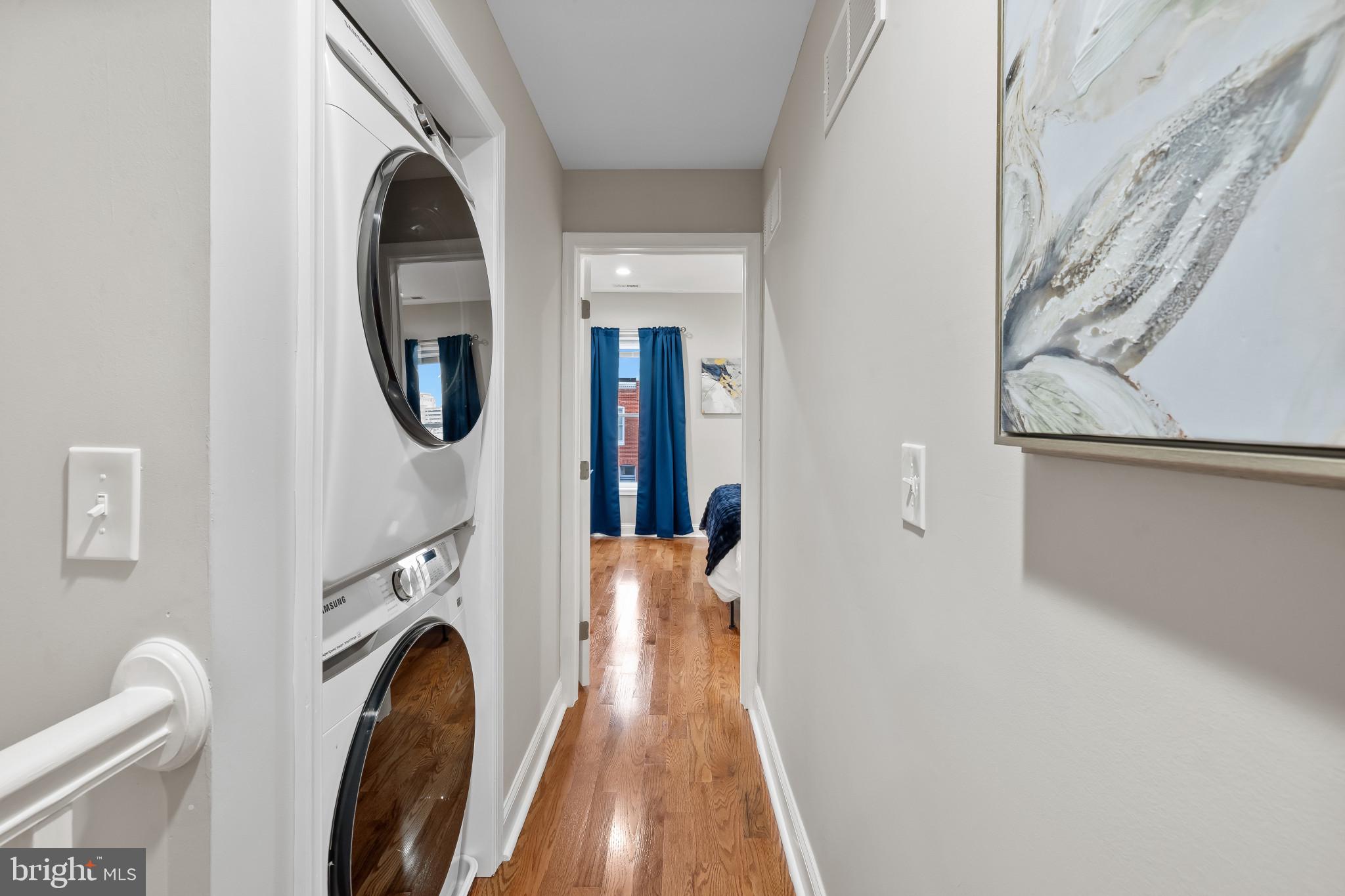 2202 East Chase Street Baltimore, MD 21213 - Photo 19 of 33 a view of a hallway with washer and dryer