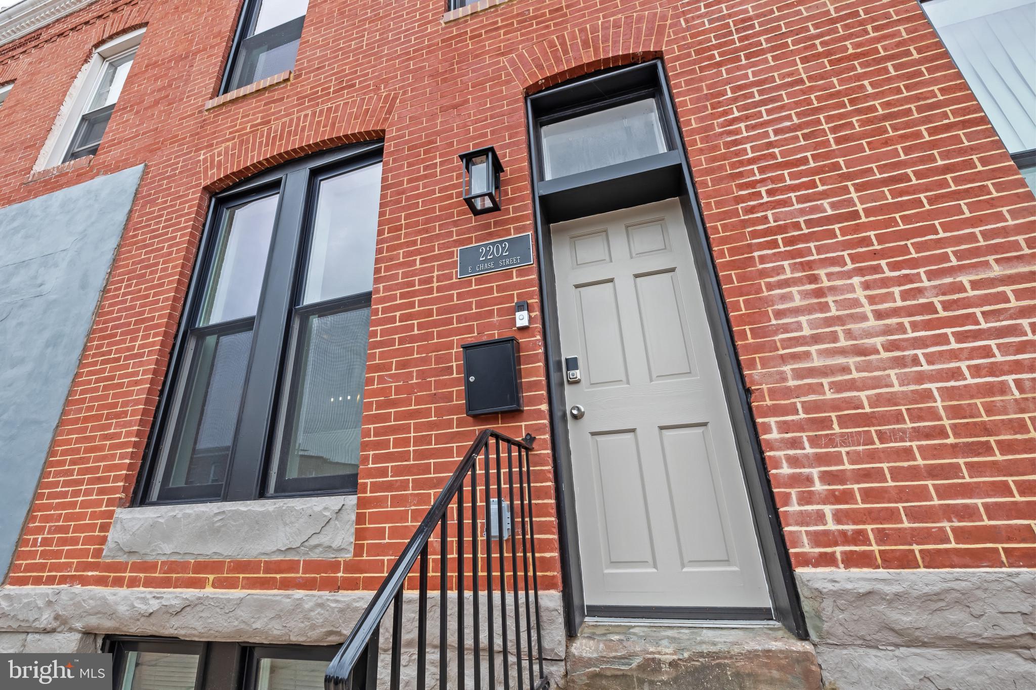 2202 East Chase Street Baltimore, MD 21213 - Photo 28 of 33 a view of a brick building with a door