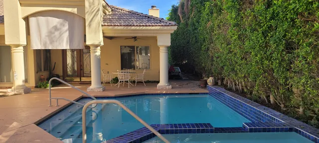 a view of front door and small yard