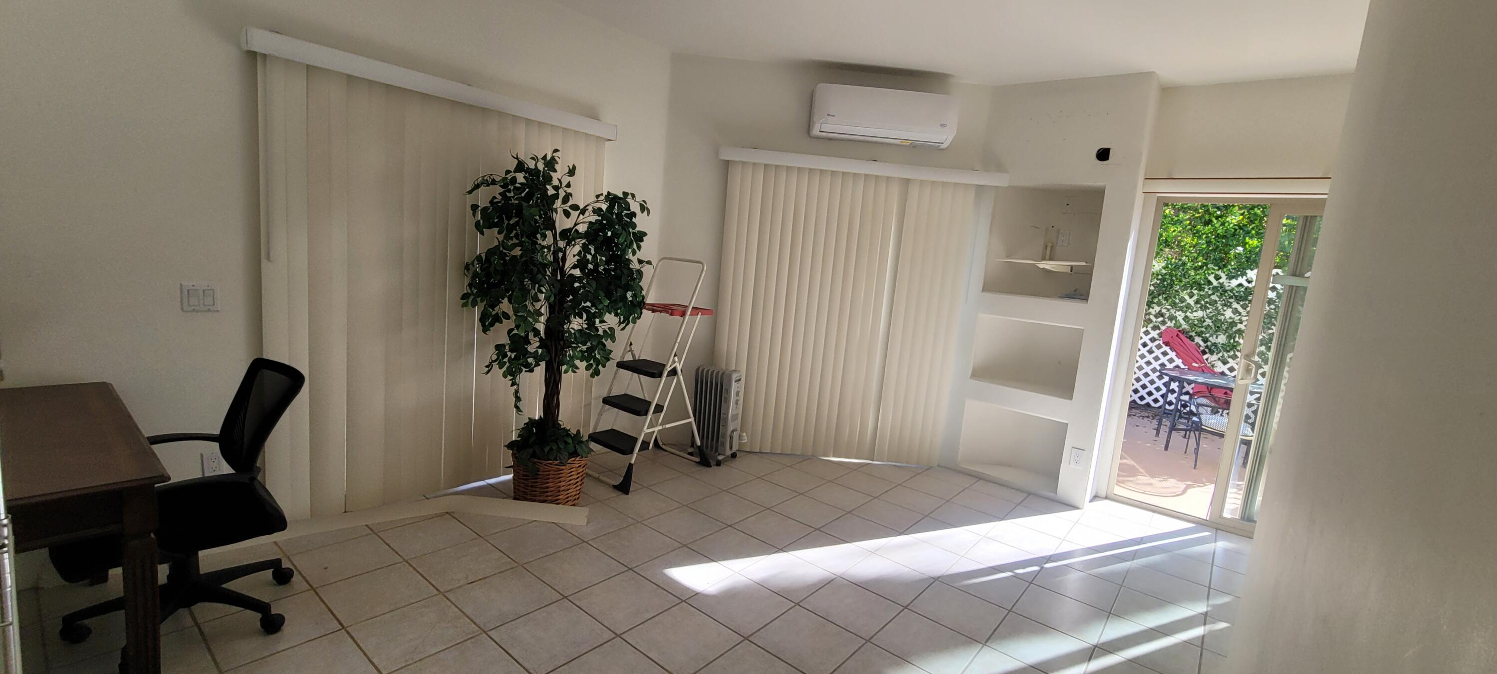 39914 Morningsprings Road Rancho Mirage, CA 92270 - Photo 18 of 54 a living room with furniture and a potted plant