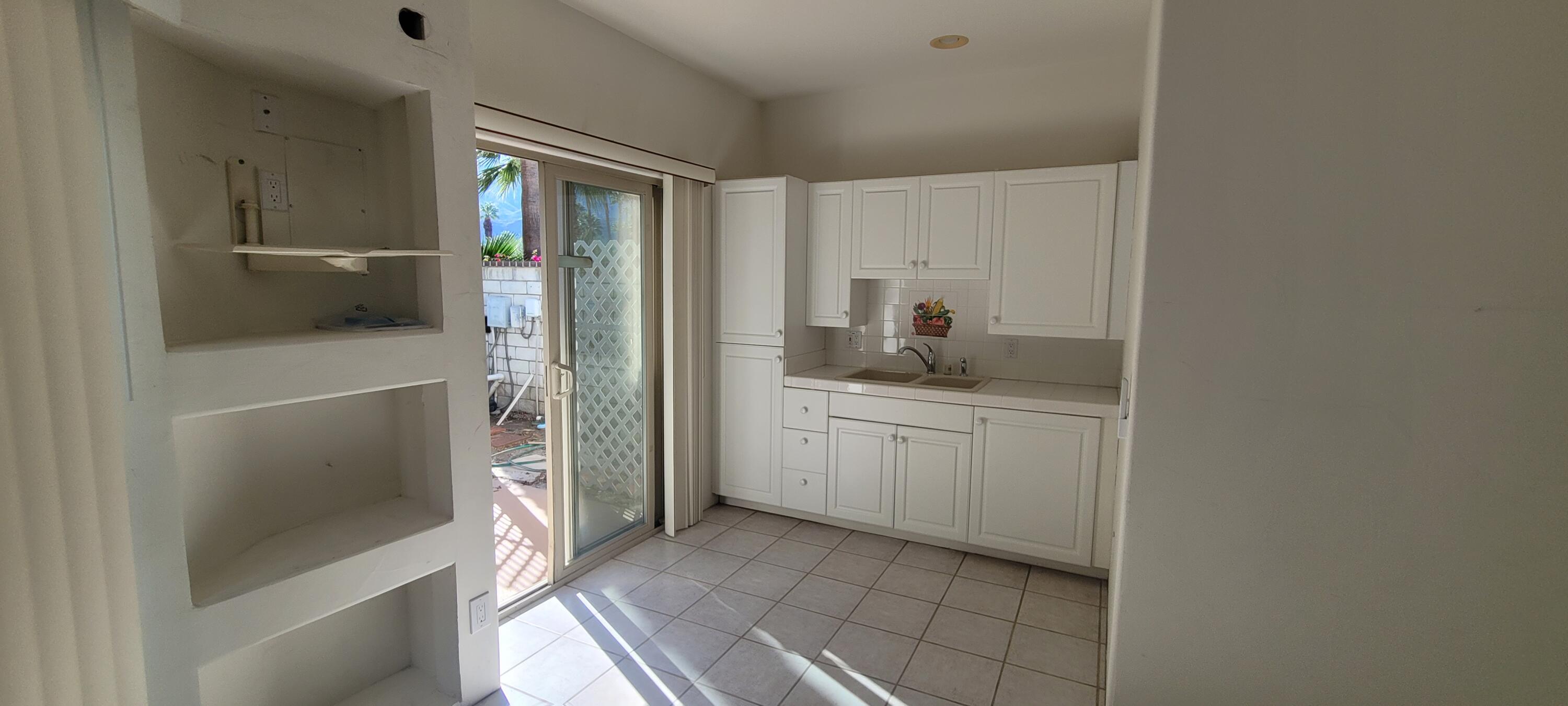 39914 Morningsprings Road Rancho Mirage, CA 92270 - Photo 20 of 54 a bathroom with a granite countertop sink and a mirror