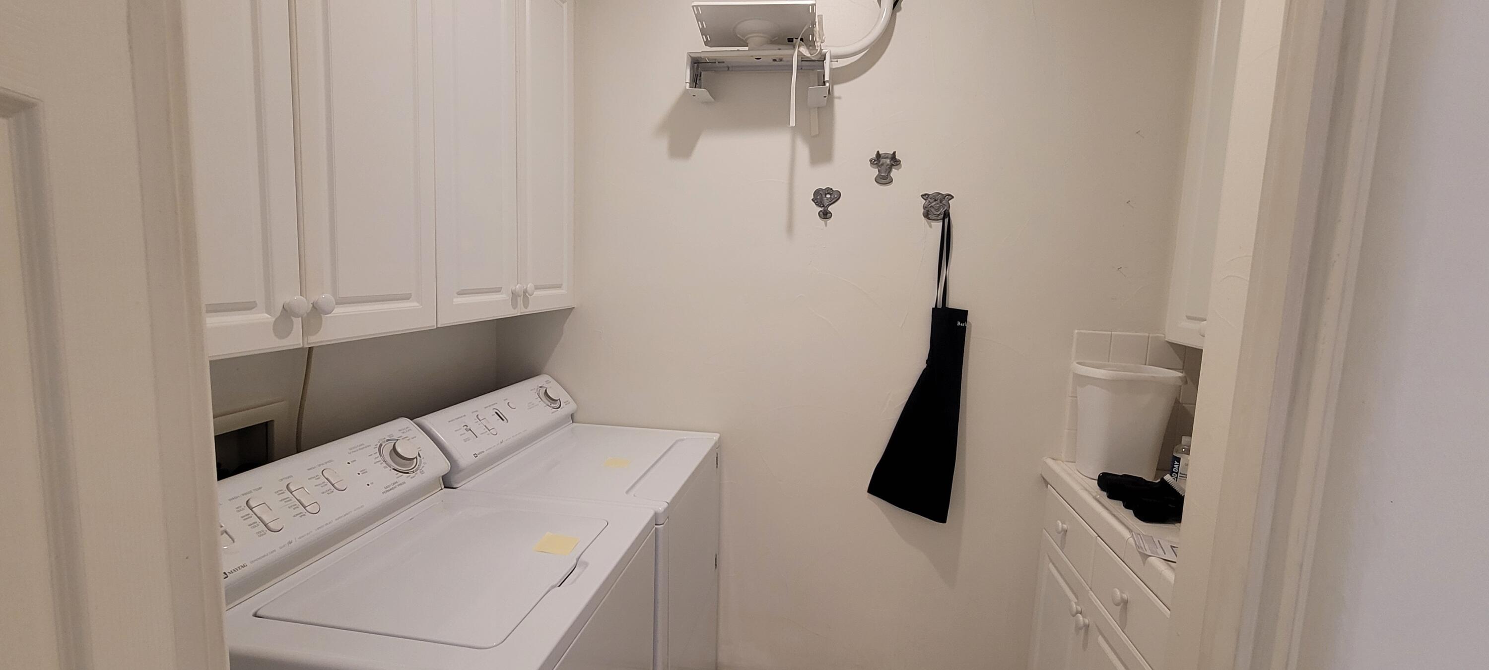 39914 Morningsprings Road Rancho Mirage, CA 92270 - Photo 31 of 54 a utility room with dryer and washer