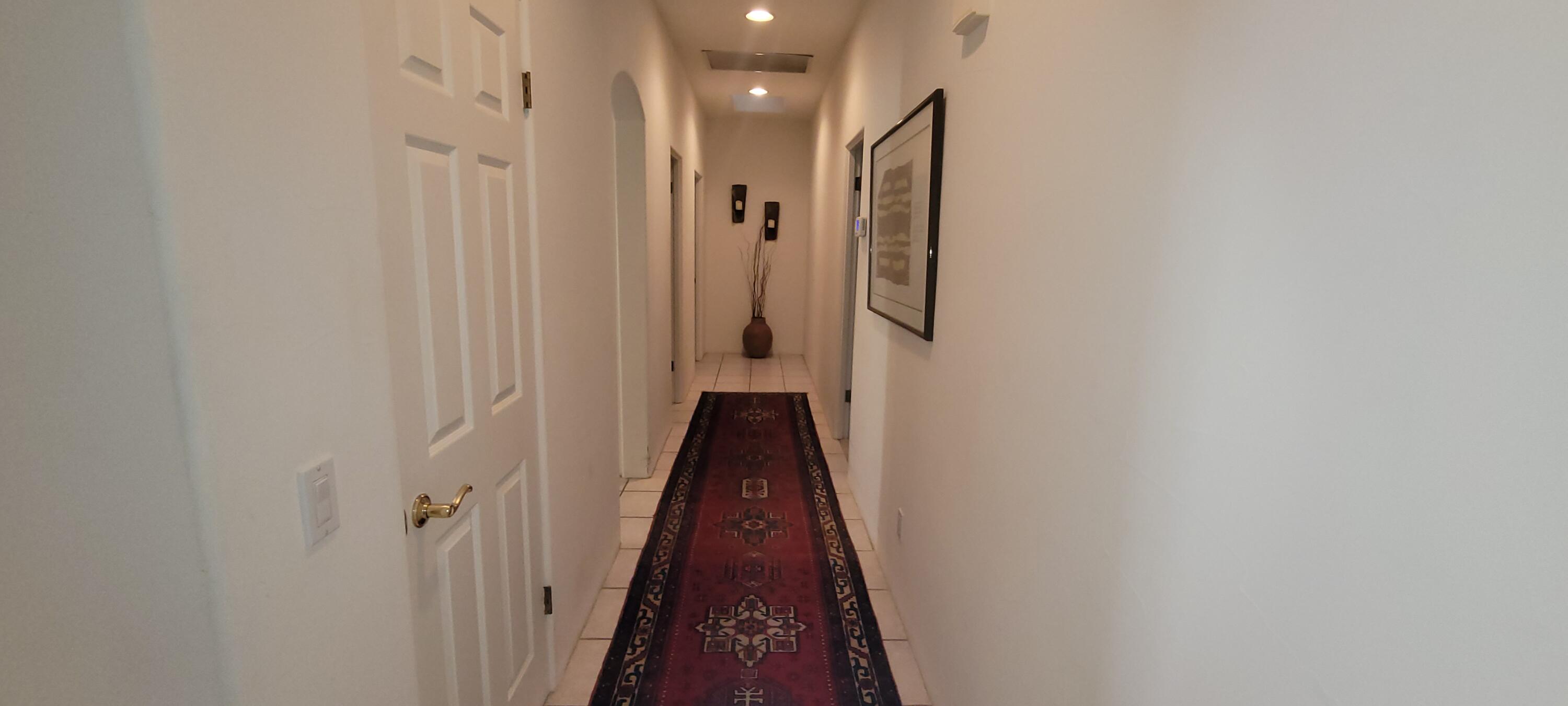 39914 Morningsprings Road Rancho Mirage, CA 92270 - Photo 35 of 54 a view of a hallway with a white walls