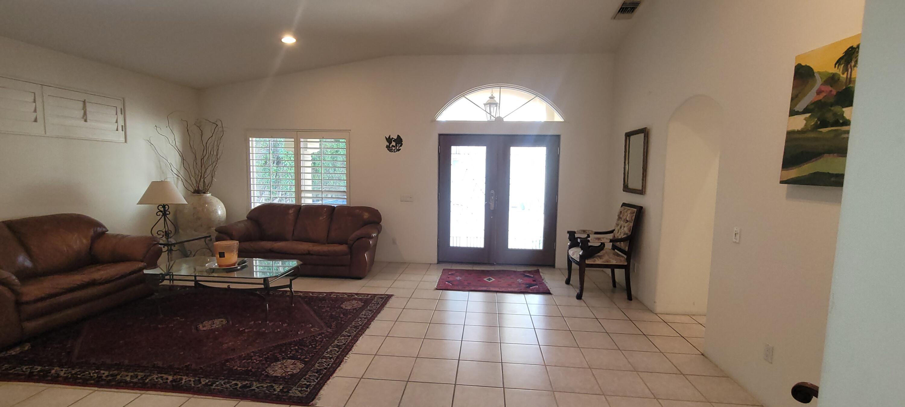 39914 Morningsprings Road Rancho Mirage, CA 92270 - Photo 36 of 54 a living room with furniture and a large window