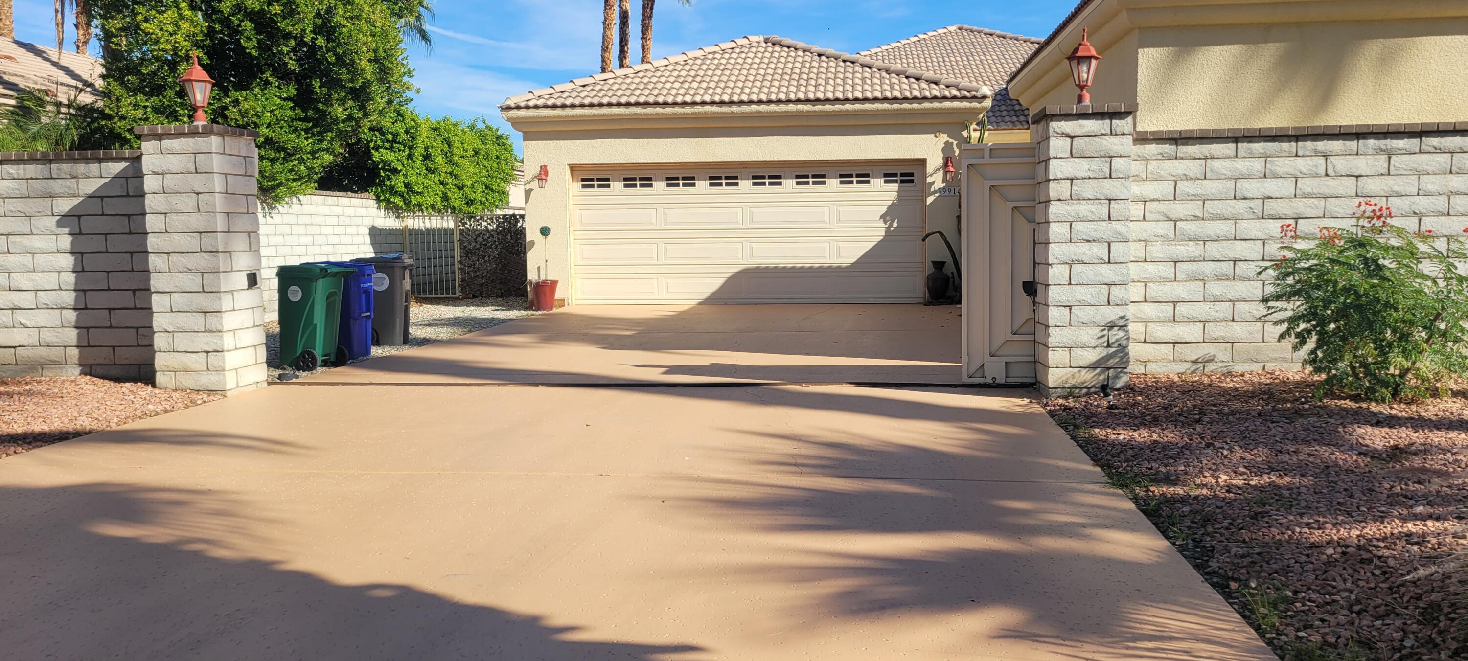 39914 Morningsprings Road Rancho Mirage, CA 92270 - Photo 4 of 54 a front view of a house with a garage
