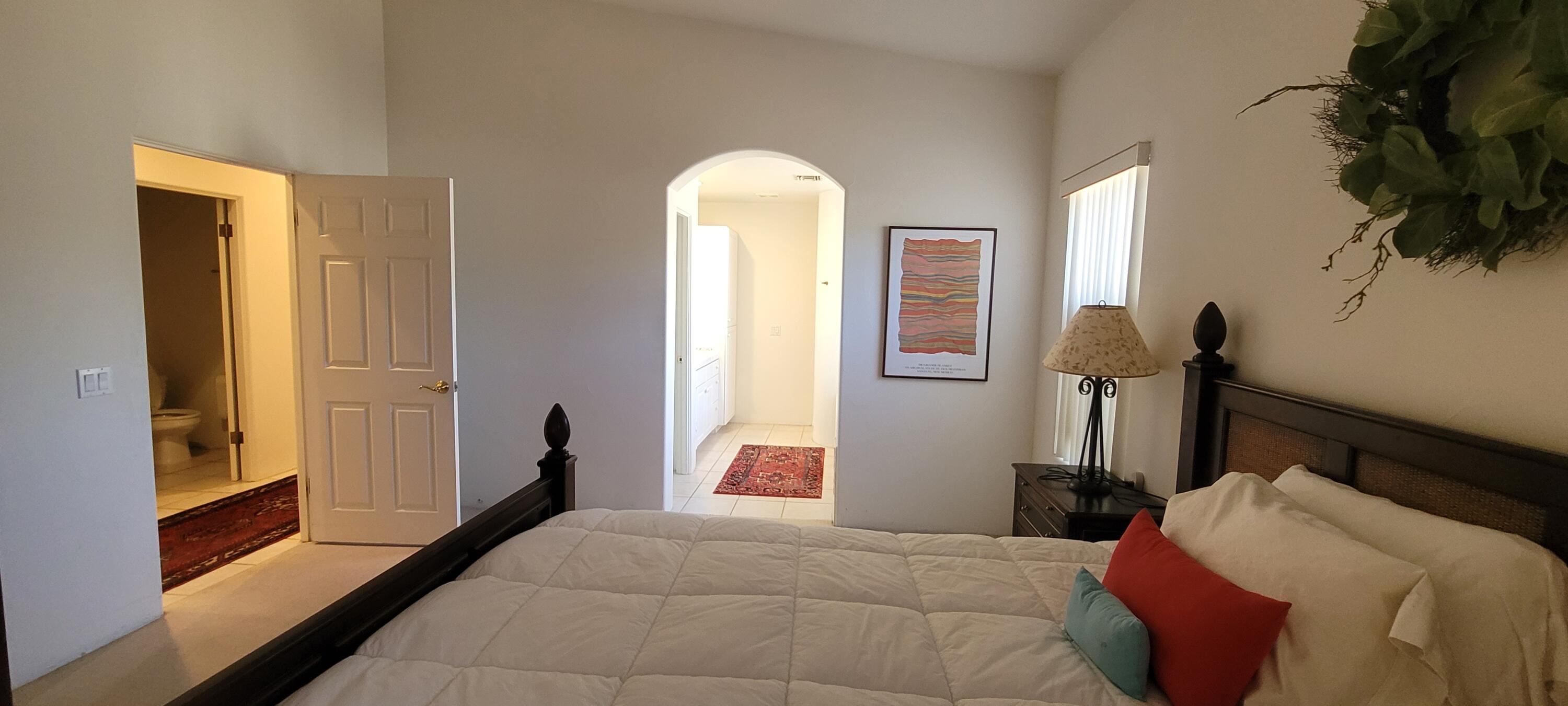 39914 Morningsprings Road Rancho Mirage, CA 92270 - Photo 41 of 54 a bedroom with a bed and a painting on the wall