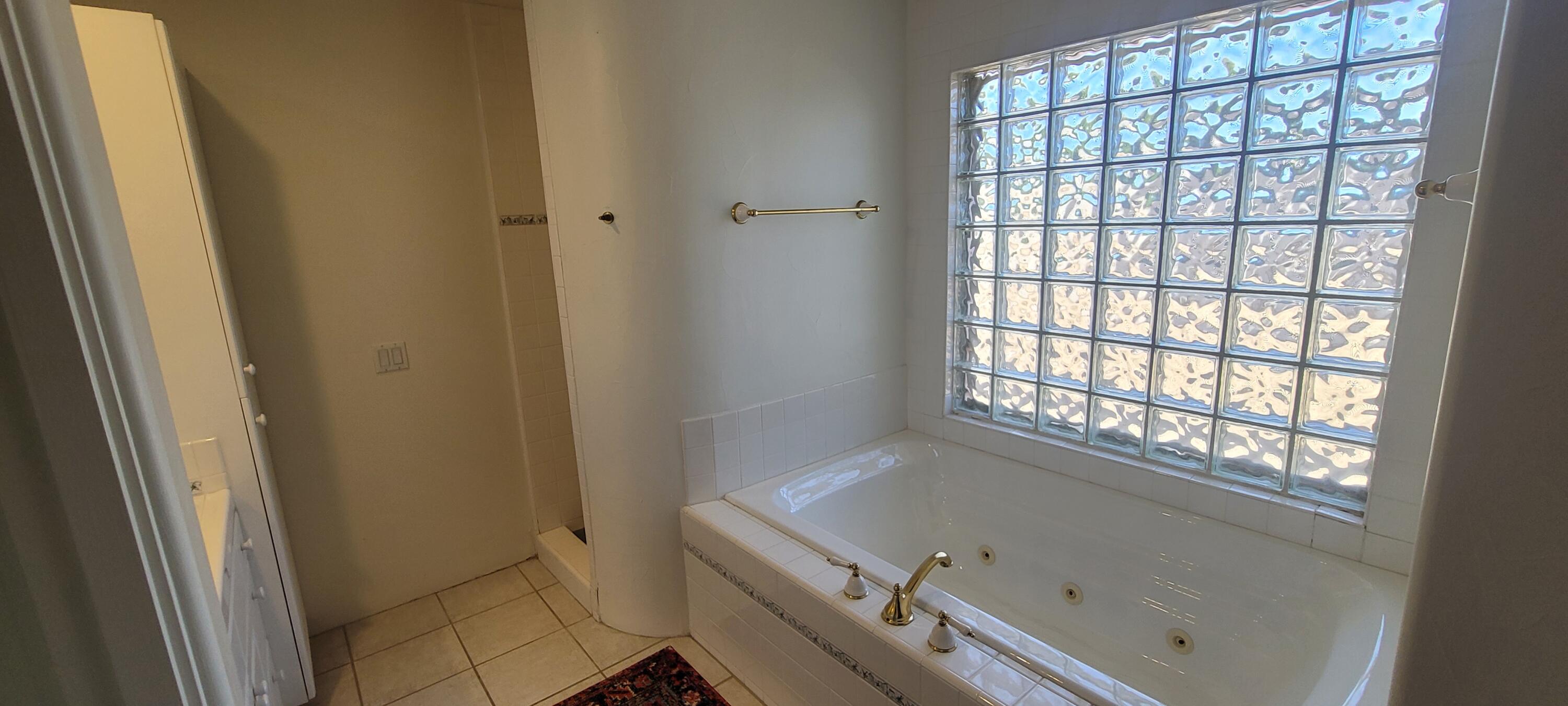 39914 Morningsprings Road Rancho Mirage, CA 92270 - Photo 42 of 54 a bath tub sitting next to a window