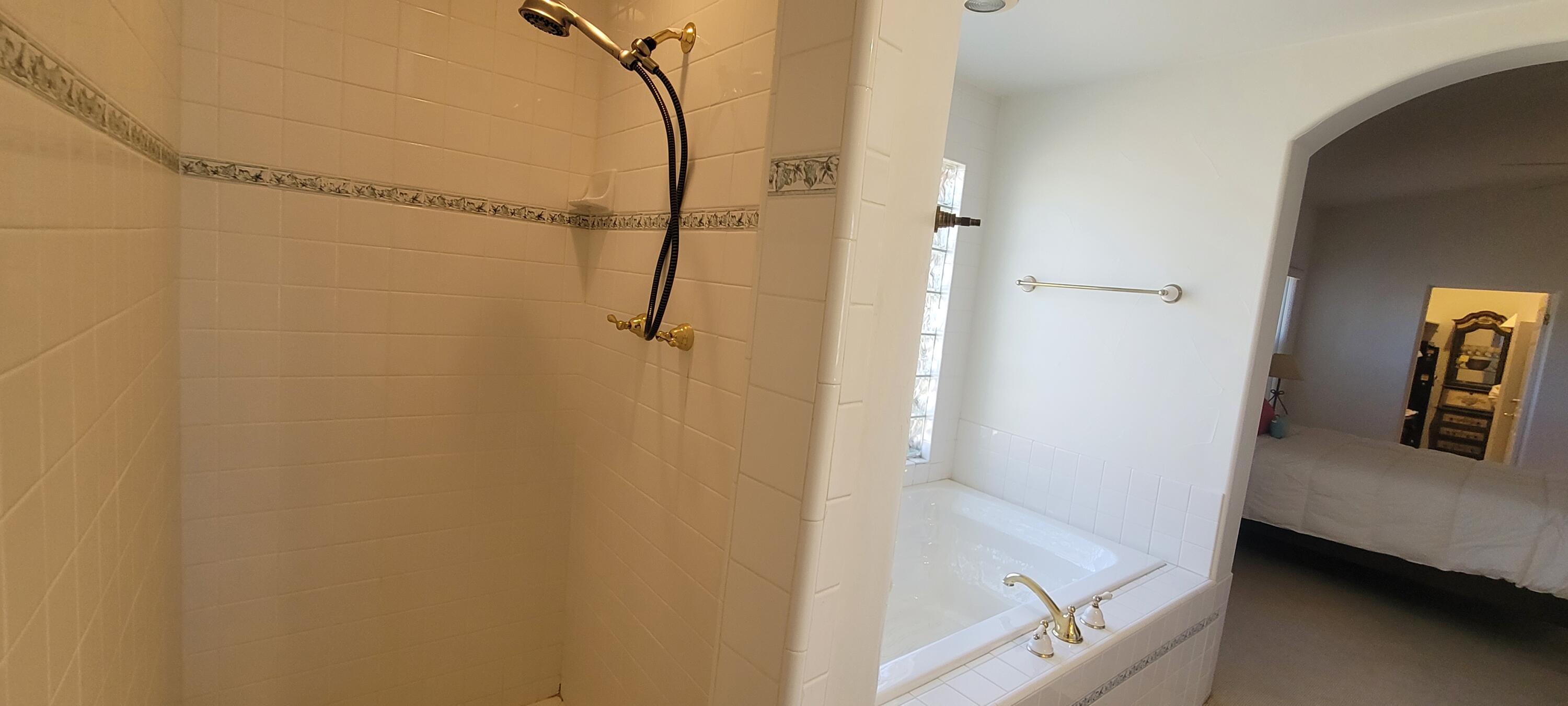 39914 Morningsprings Road Rancho Mirage, CA 92270 - Photo 44 of 54 a bathroom with a tub and shower