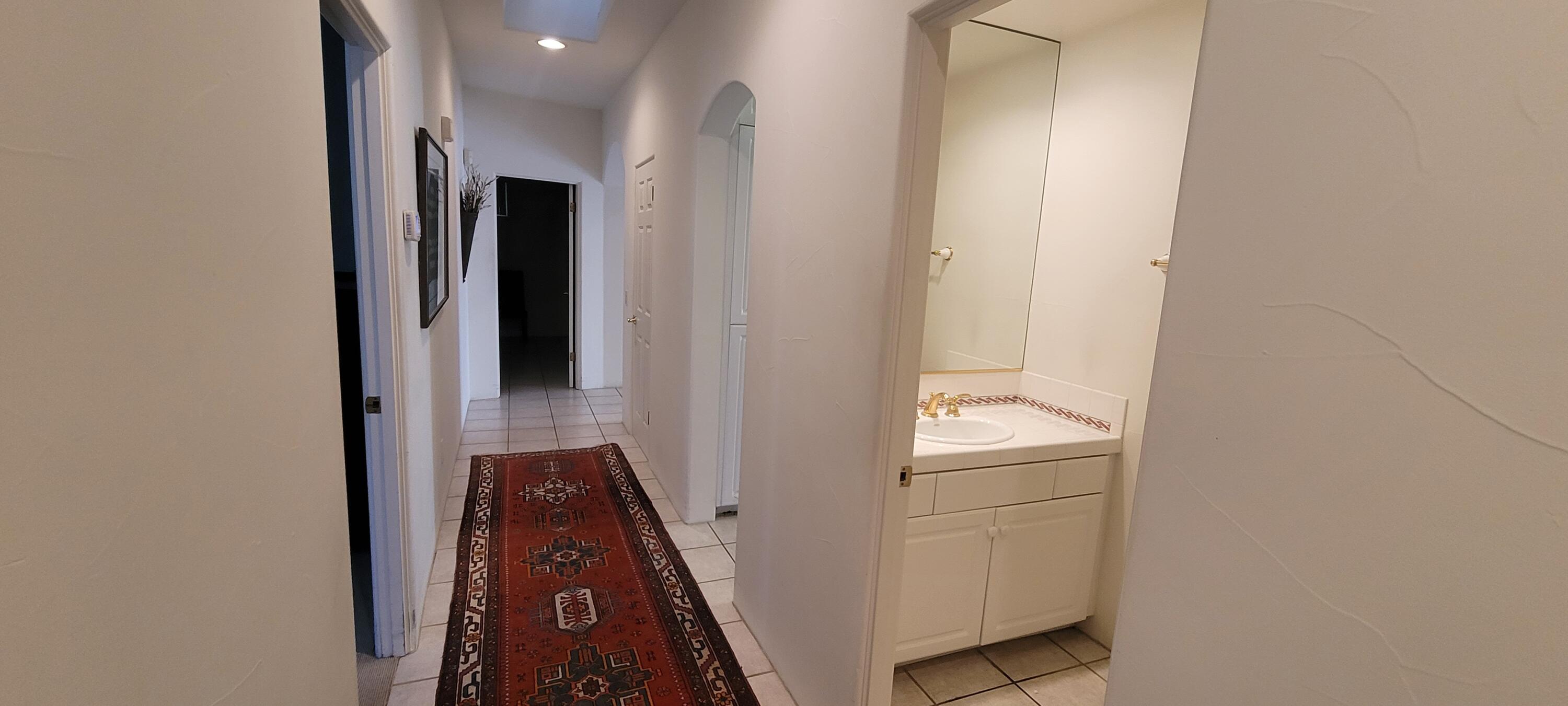 39914 Morningsprings Road Rancho Mirage, CA 92270 - Photo 47 of 54 a view of a hallway with washer and dryer