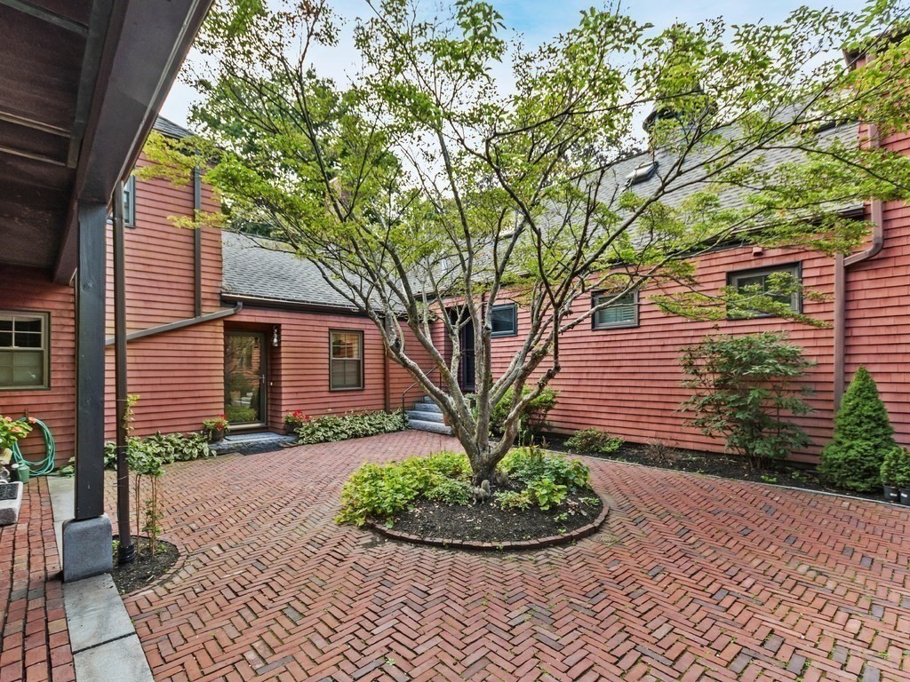 76 Ober Road, Unit 76 Newton, MA 02459 - Photo 1 of 32 a front view of a house with garden