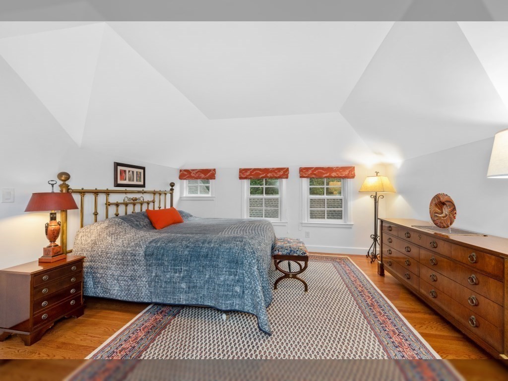 76 Ober Road, Unit 76 Newton, MA 02459 - Photo 14 of 32 a bedroom with a bed and wooden floor