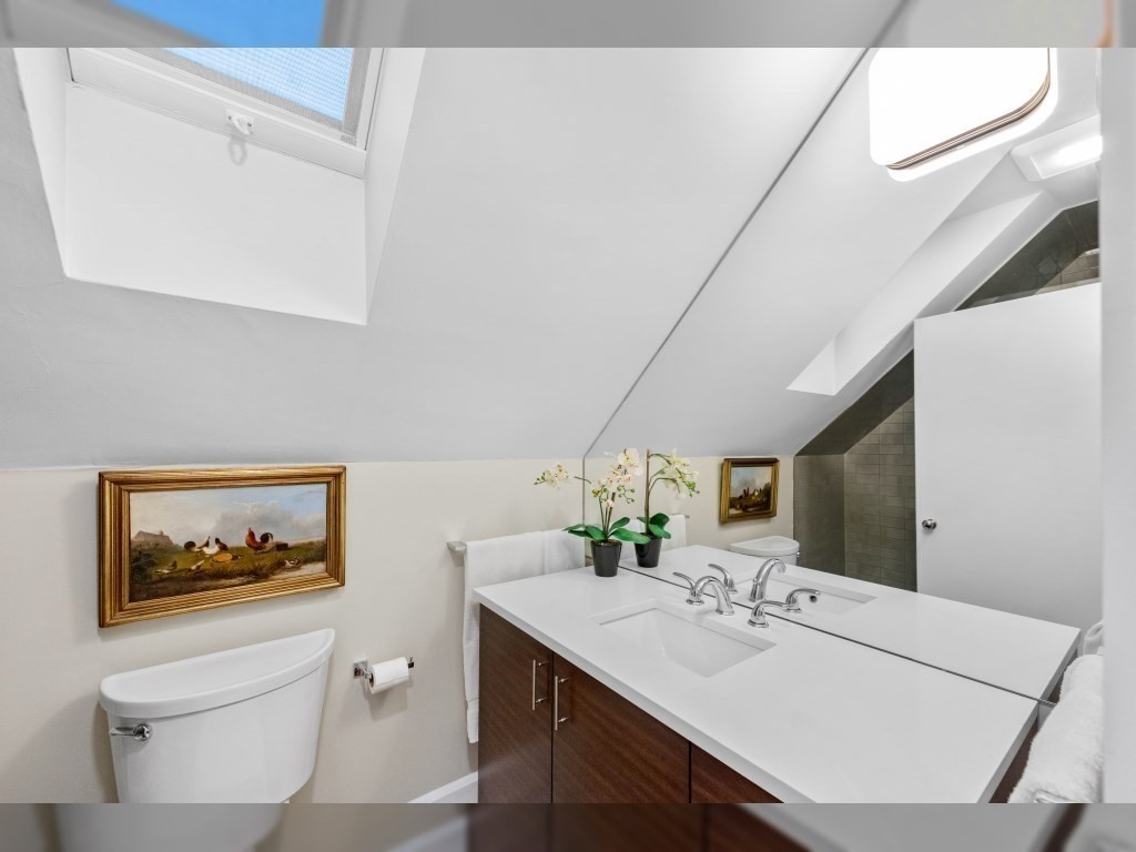 76 Ober Road, Unit 76 Newton, MA 02459 - Photo 20 of 32 a bathroom with a sink a vanity and a mirror