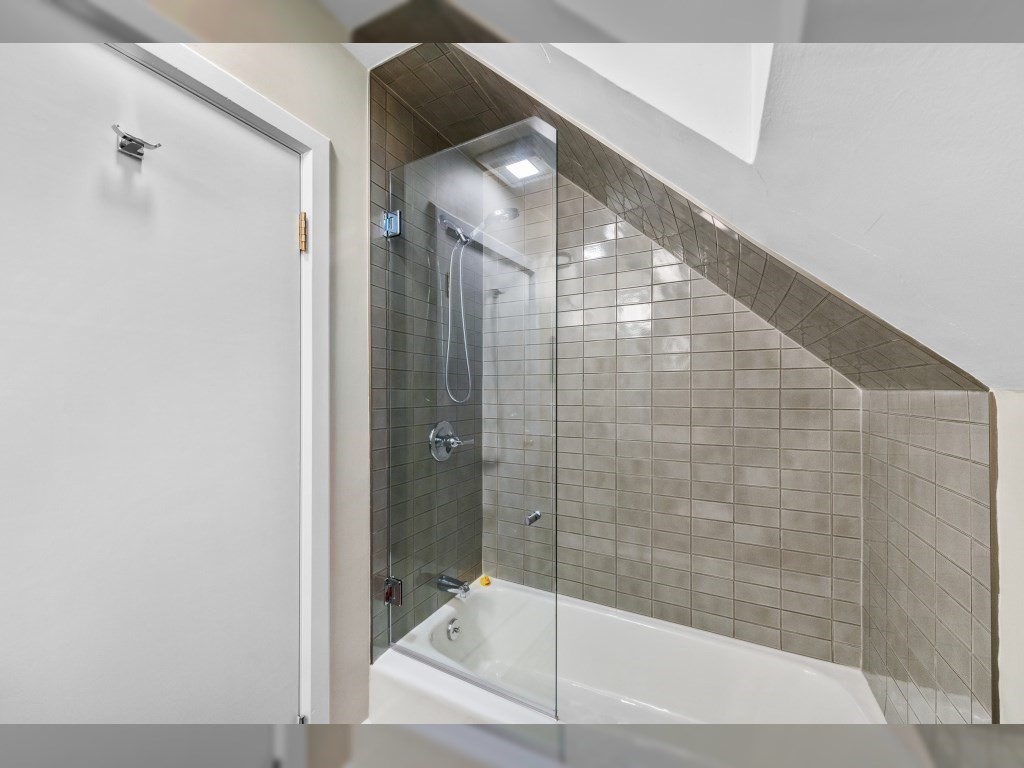 76 Ober Road, Unit 76 Newton, MA 02459 - Photo 21 of 32 a bathroom with a glass shower door and mirror