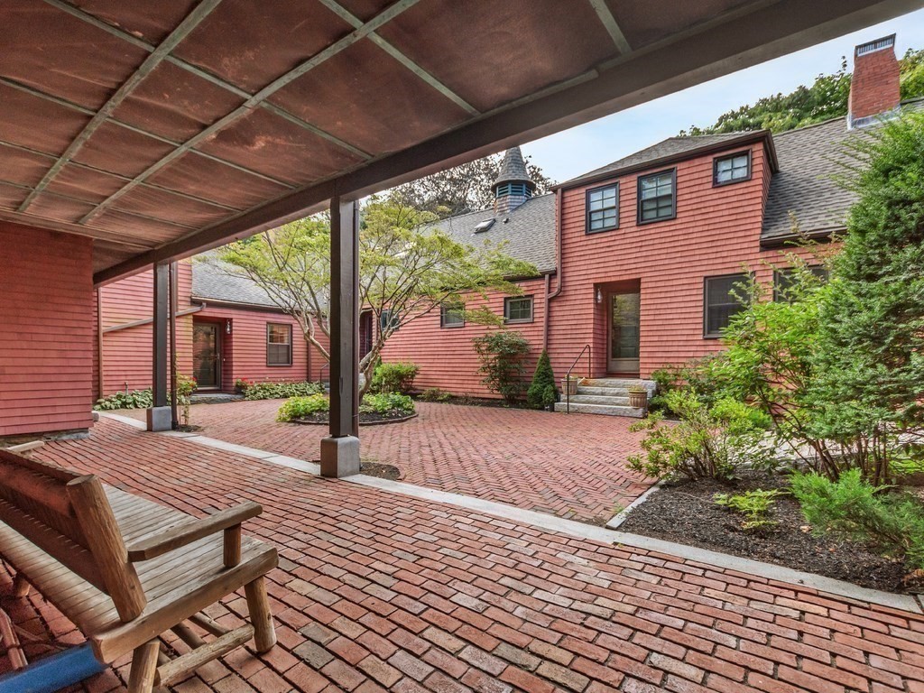 76 Ober Road, Unit 76 Newton, MA 02459 - Photo 22 of 32 a view of a backyard with plants and outdoor seating