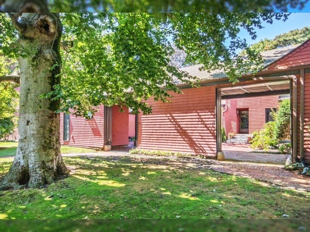 76 Ober Road, Unit 76 Newton, MA 02459 - Photo 23 of 32 a front view of a house with a yard and garage
