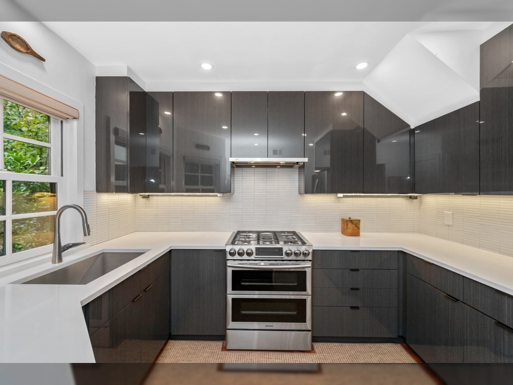 76 Ober Road, Unit 76 Newton, MA 02459 - Photo 8 of 32 a kitchen with stainless steel appliances a sink stove and cabinets