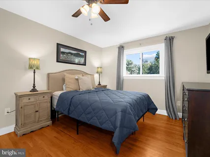 a white bath tub sitting next to a small window