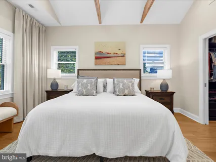 a view of a roof deck with table and chairs