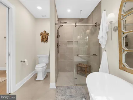 outdoor view of a lake with table and chairs