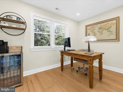 a view of a swimming pool with a table and chairs