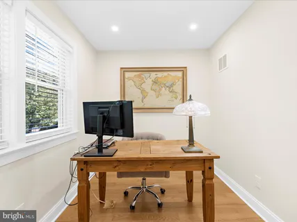 a view of a house with swimming pool and sitting area