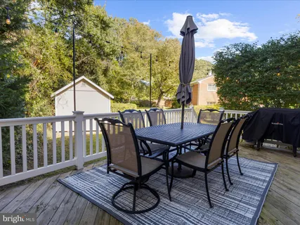 an aerial view of a house with a yard swimming pool and outdoor seating