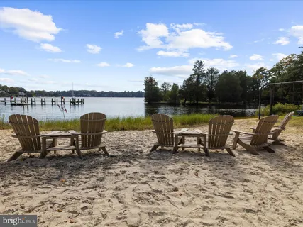 an aerial view of a house with outdoor space