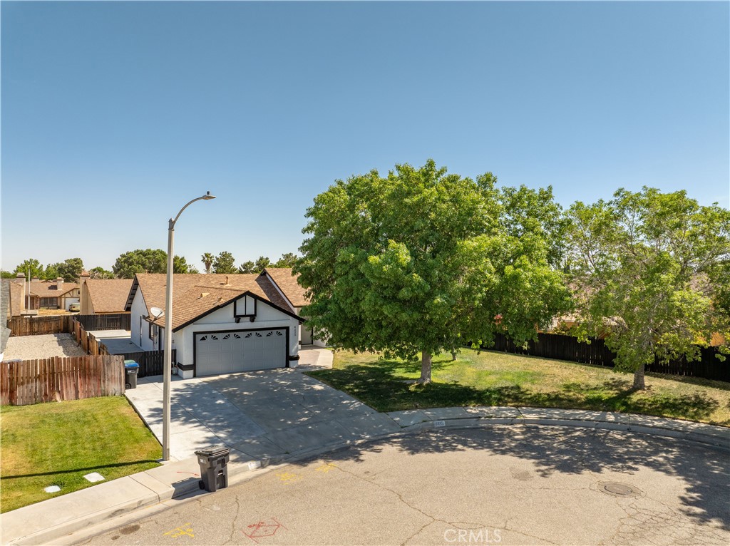 4225 Saddleback Road Palmdale, CA 93552 - Photo 13 of 61 a front view of a house with a yard