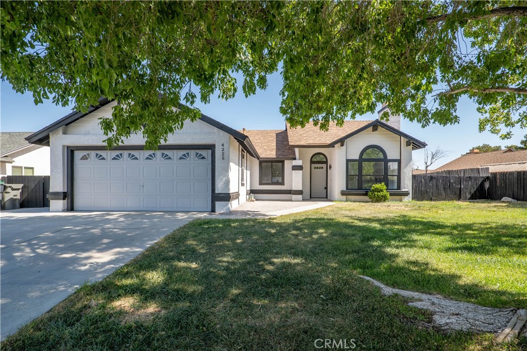 4225 Saddleback Road Palmdale, CA 93552 - Photo 3 of 61 a front view of a house with garden