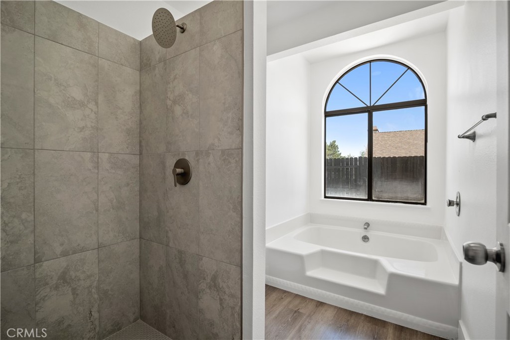 4225 Saddleback Road Palmdale, CA 93552 - Photo 34 of 61 a bathroom with a sink and a window