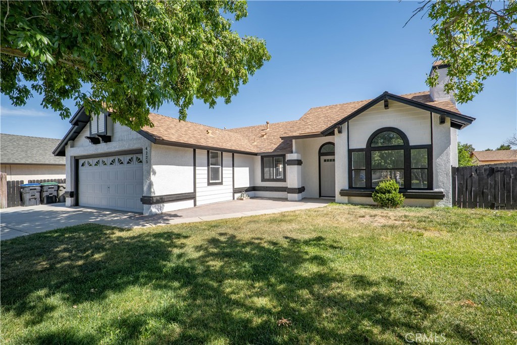 4225 Saddleback Road Palmdale, CA 93552 - Photo 4 of 61 a view of a house with a yard and large tree