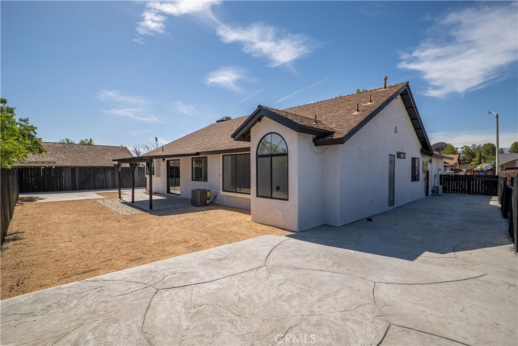 4225 Saddleback Road Palmdale, CA 93552 - Photo 46 of 61 a front view of a house with a yard