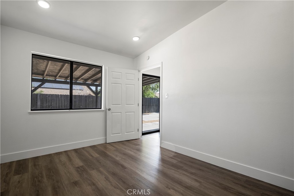 4225 Saddleback Road Palmdale, CA 93552 - Photo 50 of 61 a view of empty room with wooden floor and fan