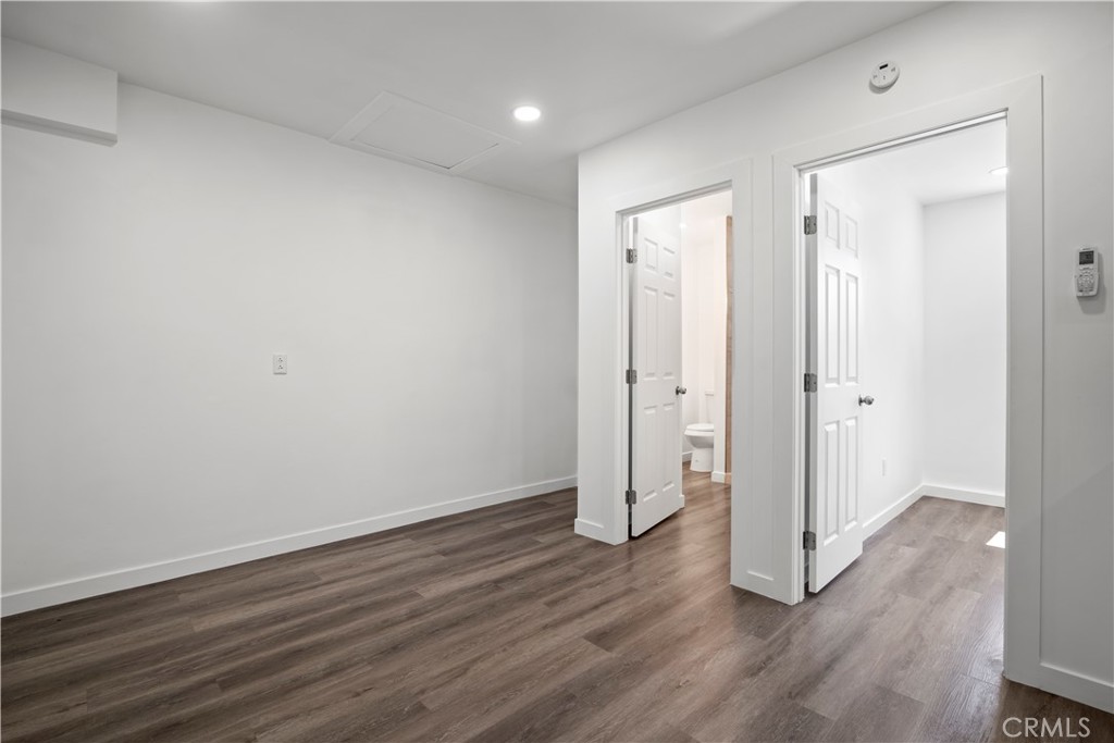 4225 Saddleback Road Palmdale, CA 93552 - Photo 56 of 61 a view of an empty room with wooden floor