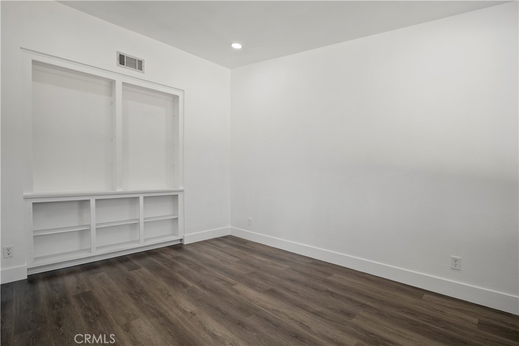 4225 Saddleback Road Palmdale, CA 93552 - Photo 58 of 61 a view of an empty room with wooden floor and closet